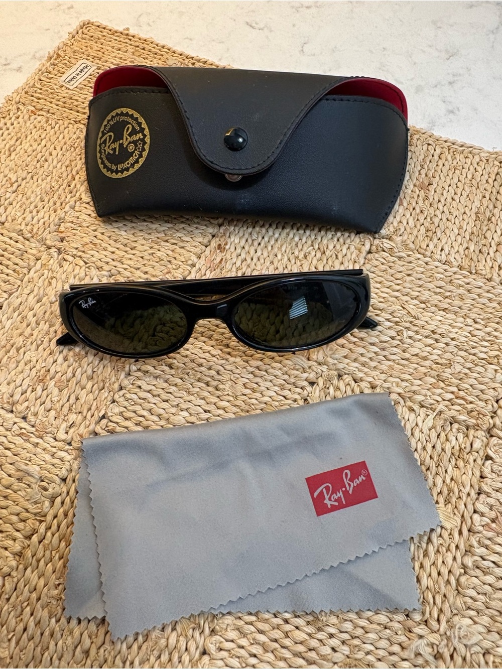 Ray-Ban women’s Black Oval Sunglasses with Dark Lenses